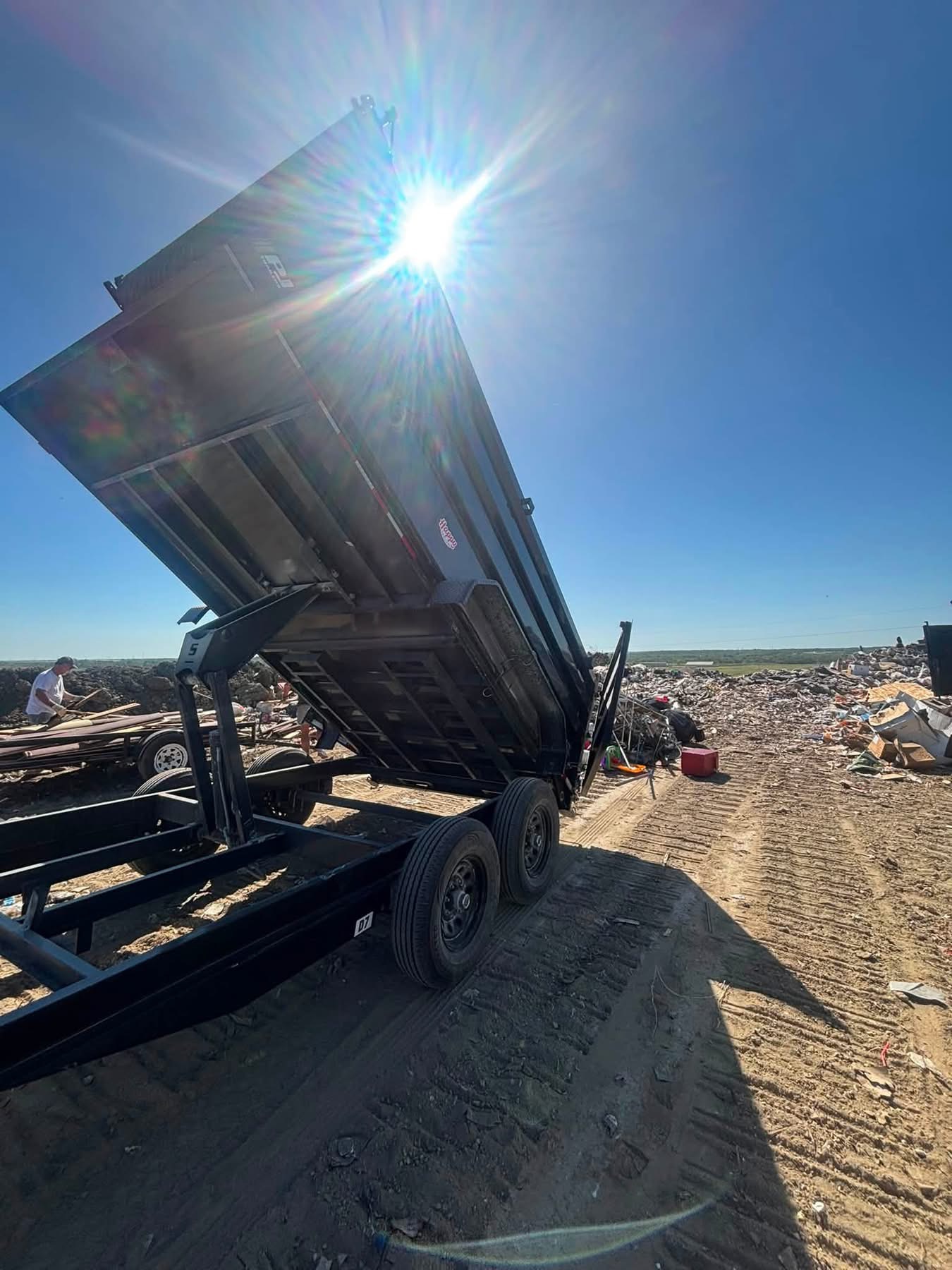 Dump trailer unloading debris